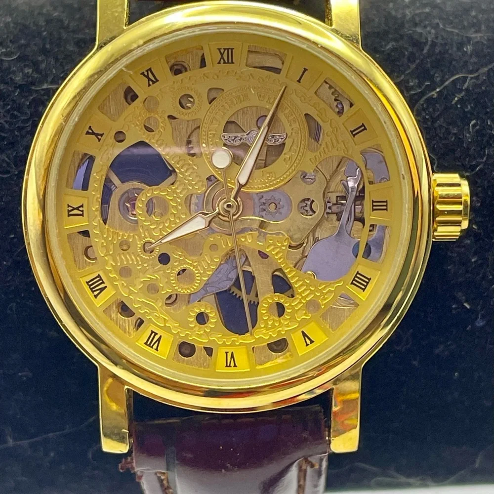 Gold Tone Skeleton Mechanical Watch with Burgundy Faux Textured Leather Strap